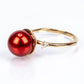 Anillo de Plata Bañada en Oro con Perla roja de río y Topacio Blanco