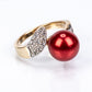Anillo de Plata Bañada en Oro con Perla roja de río y Topacio Blanco