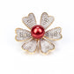 Broche de Plata Bañada en Oro con Perla roja de río y Topacio Blanco