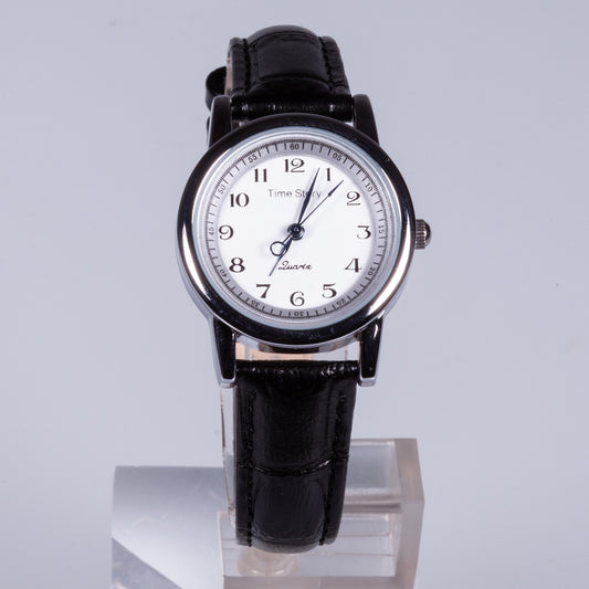 Reloj de acero inoxidable, correa de cuero genuino negro y esfera blanca.